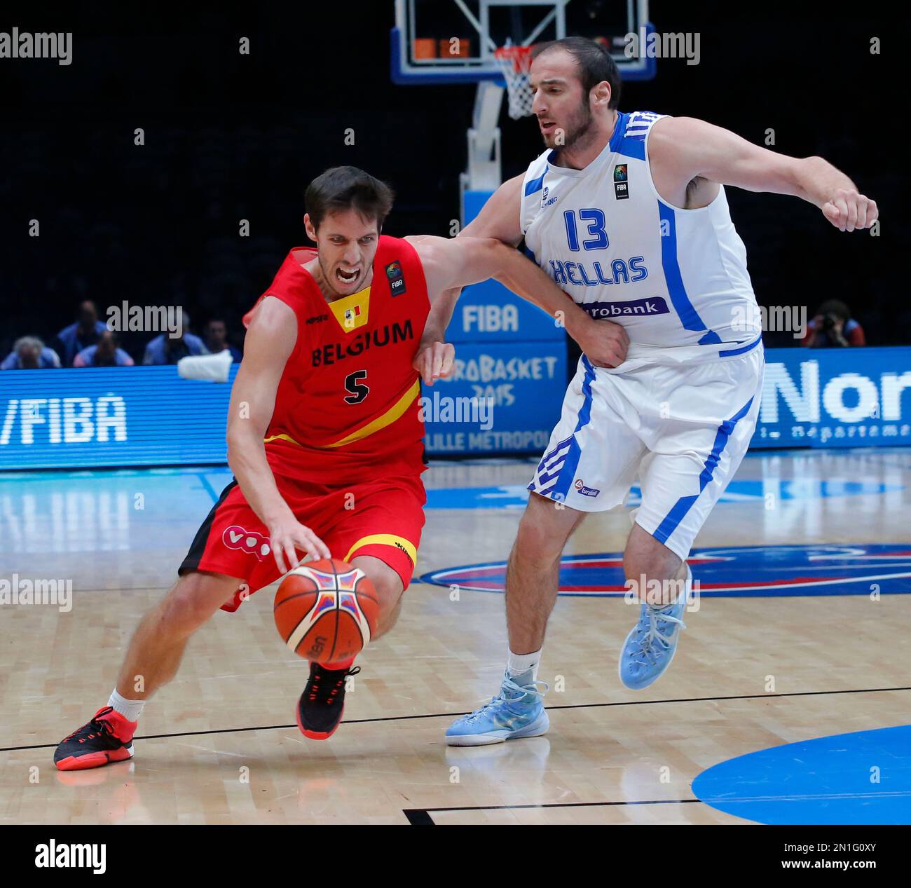 Belgium's Sam van Rossom, left, drives the ball past Kosta Koufos during  the EuroBasket European Basketball round of sixteen match between Greece  against Belgium, at Pierre Mauroy stadium in Lille, France, Saturday,