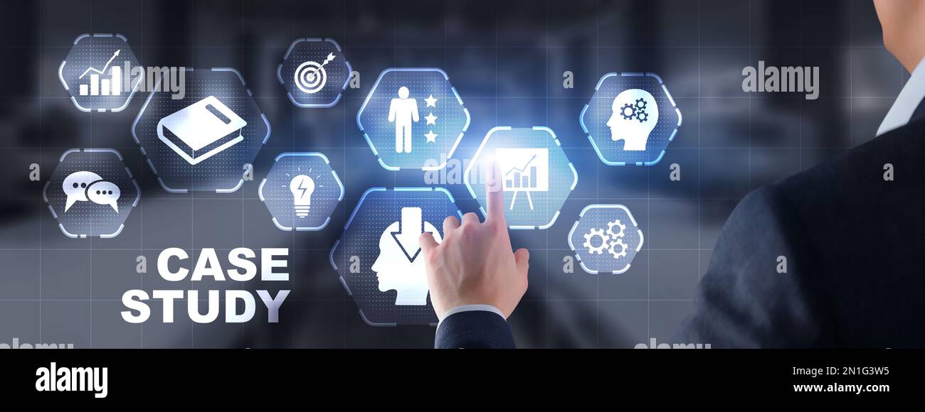 Businessman pressing case study button on virtual screens Stock Photo