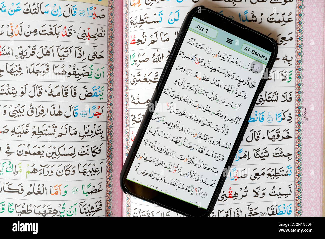Digital Quran on smartphone and traditional paper Holy Quran, paper and digital Quran, Al-Serkal Mosque, Cambodia, Indochina, Southeast Asia, Asia Stock Photo
