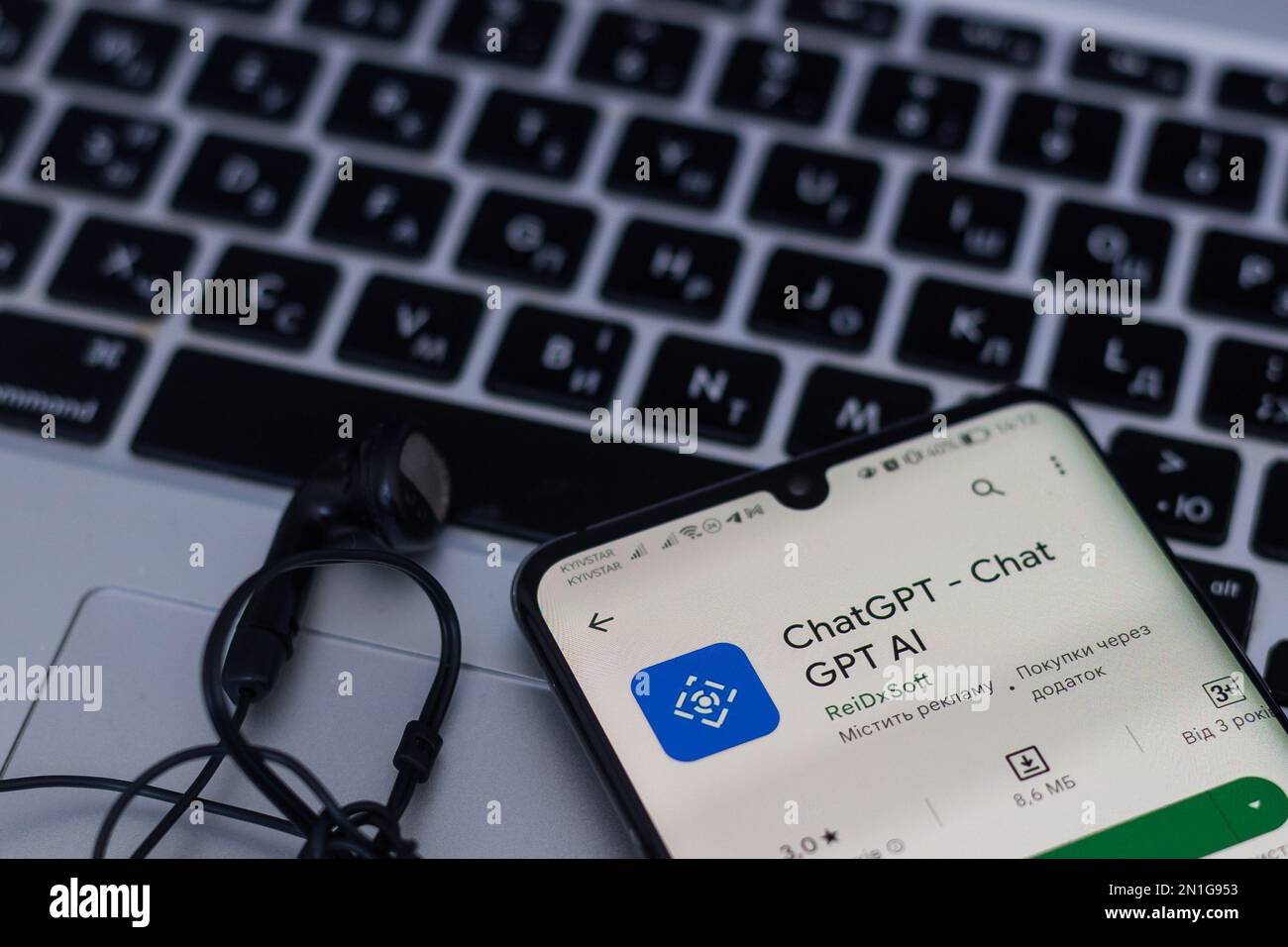 Screen with ChatGPT chat with AI or artificial intelligence. Man search for information using artificial intelligence chatbot developed by OpenAI Stock Photo