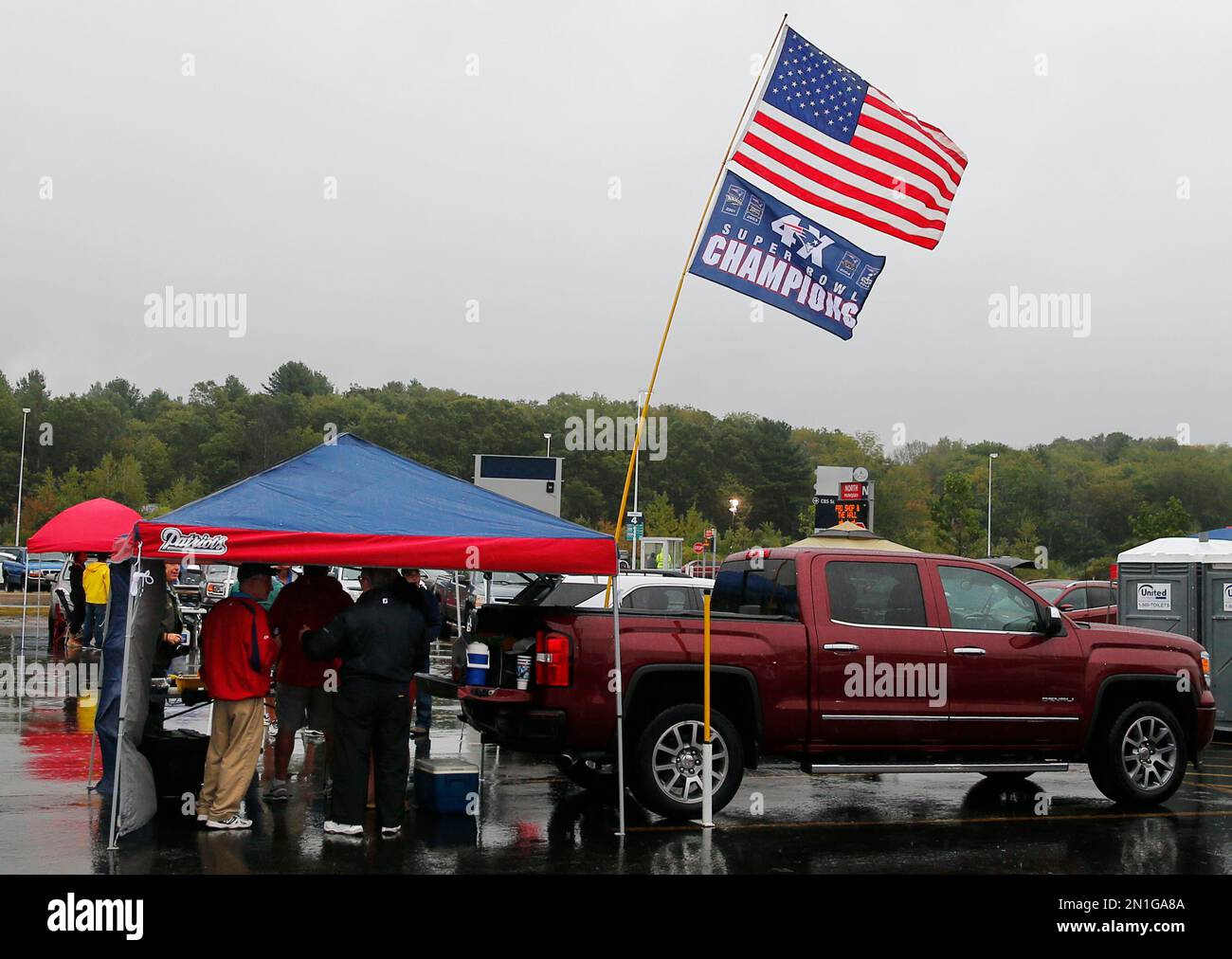 New England Patriots' fans spend time tailgating in the parking lot