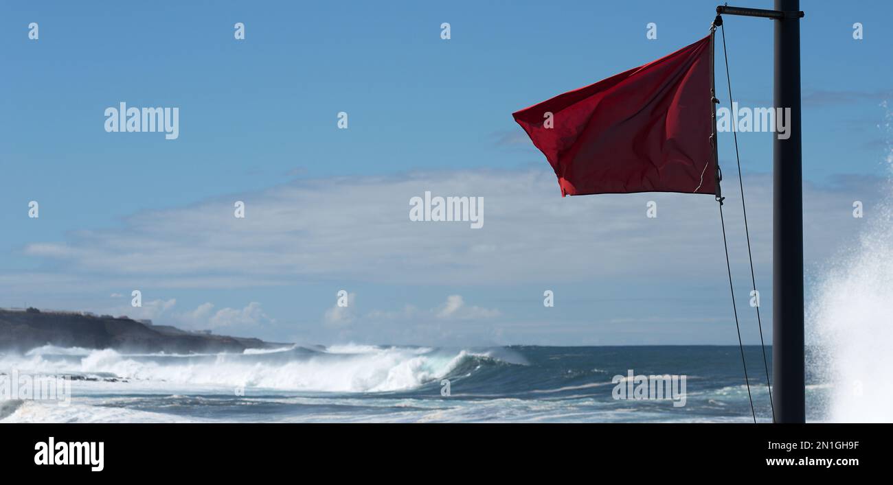 Red flag danger big waves, with no swimming notes Stock Photo - Alamy