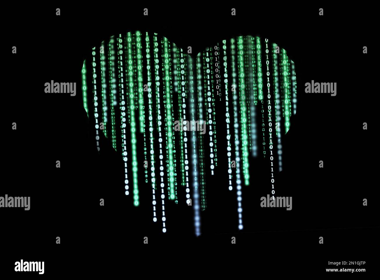Heart-shaped composed of binary computer code on a black background ...