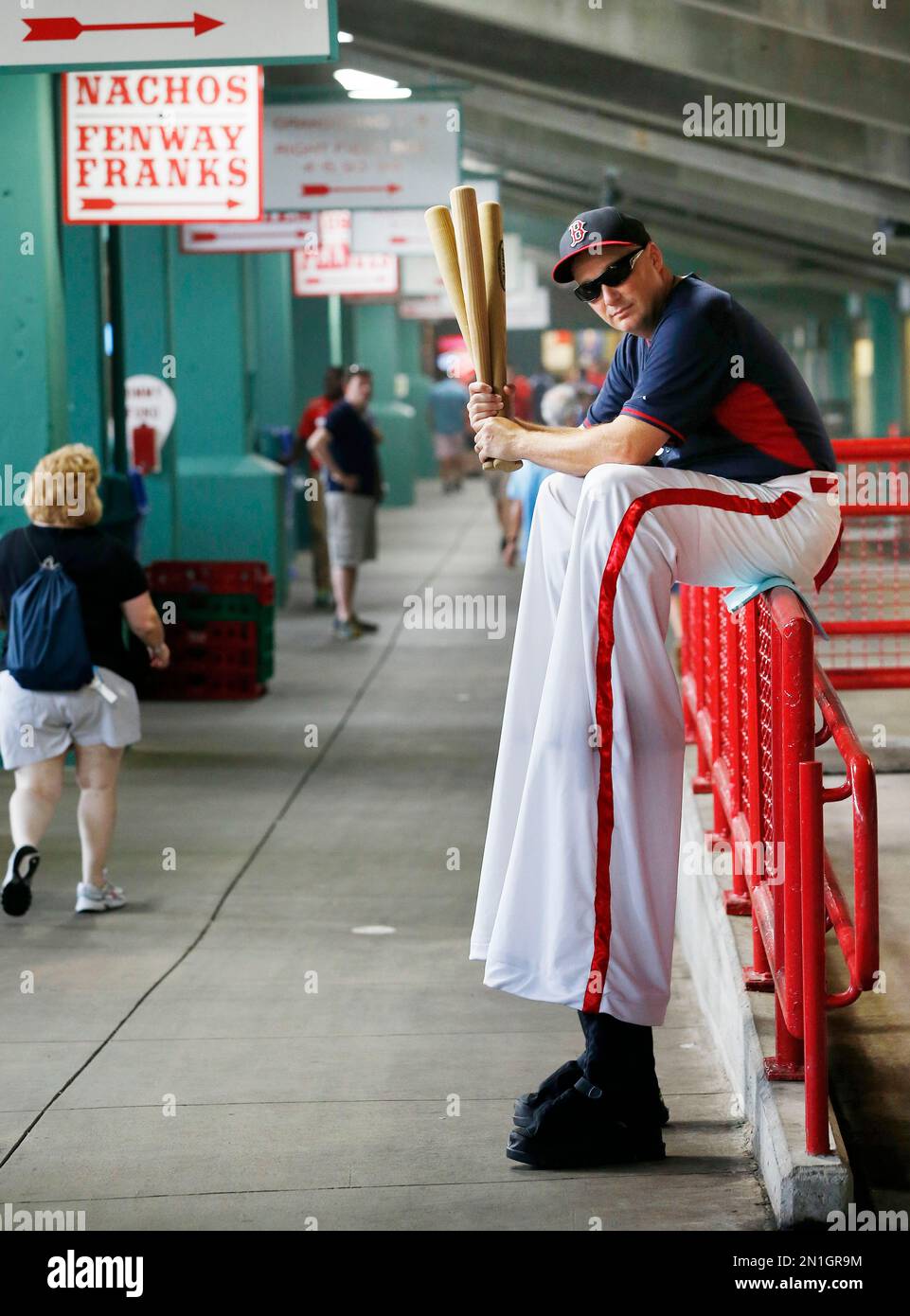 Stilt walker Jay Stewart waits for fans to arrive in the concourse at
