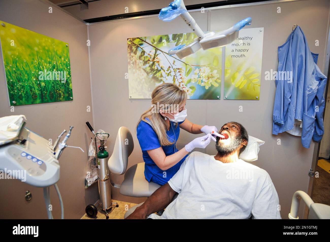 Dentist volunteer Candace Lauderdale of Columbus, Ga., administers free