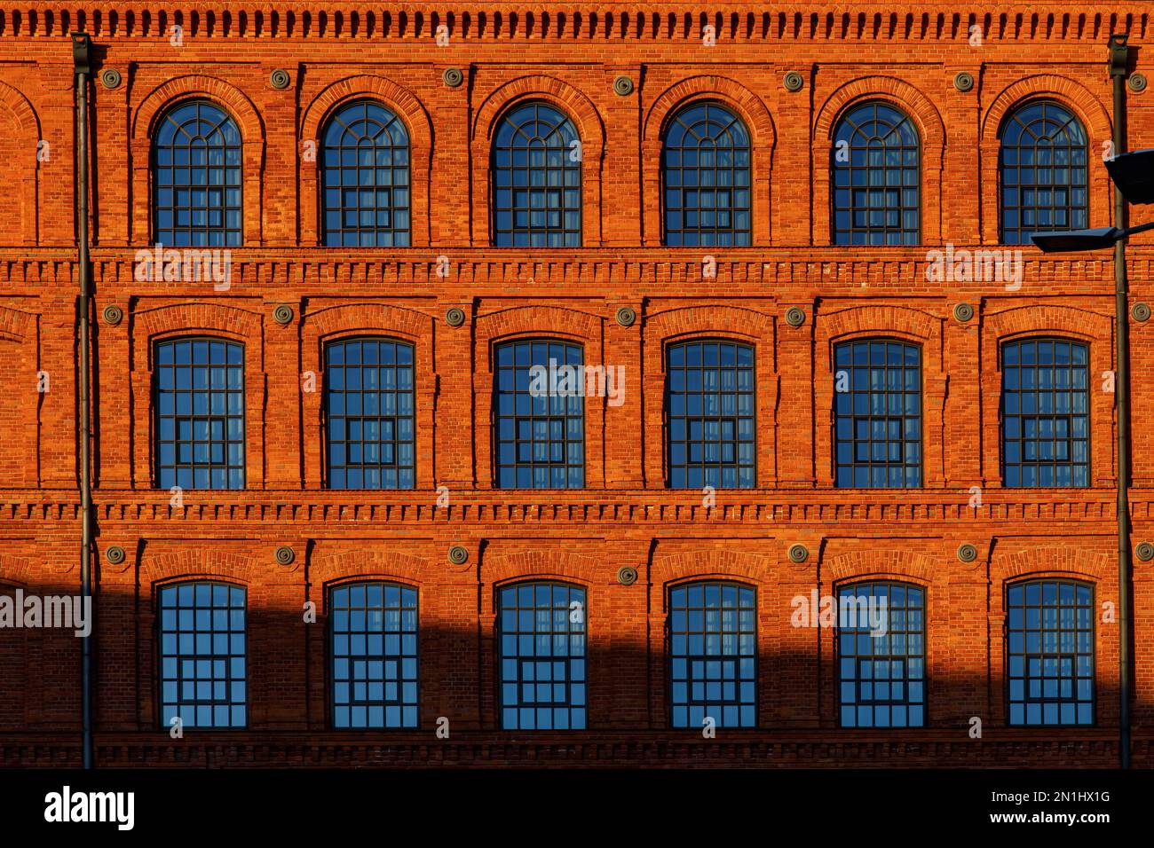 Red brick facade of the factory Stock Photo - Alamy