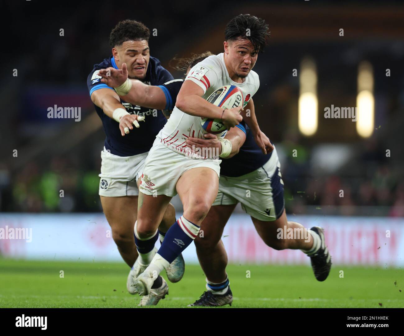 L-R Sione Tuipulotu of Scotland and England's Marcus Smithholds of Pierre Schoeman of Scotland  during the Guinness Six Nations Calcutta Cup match bet Stock Photo