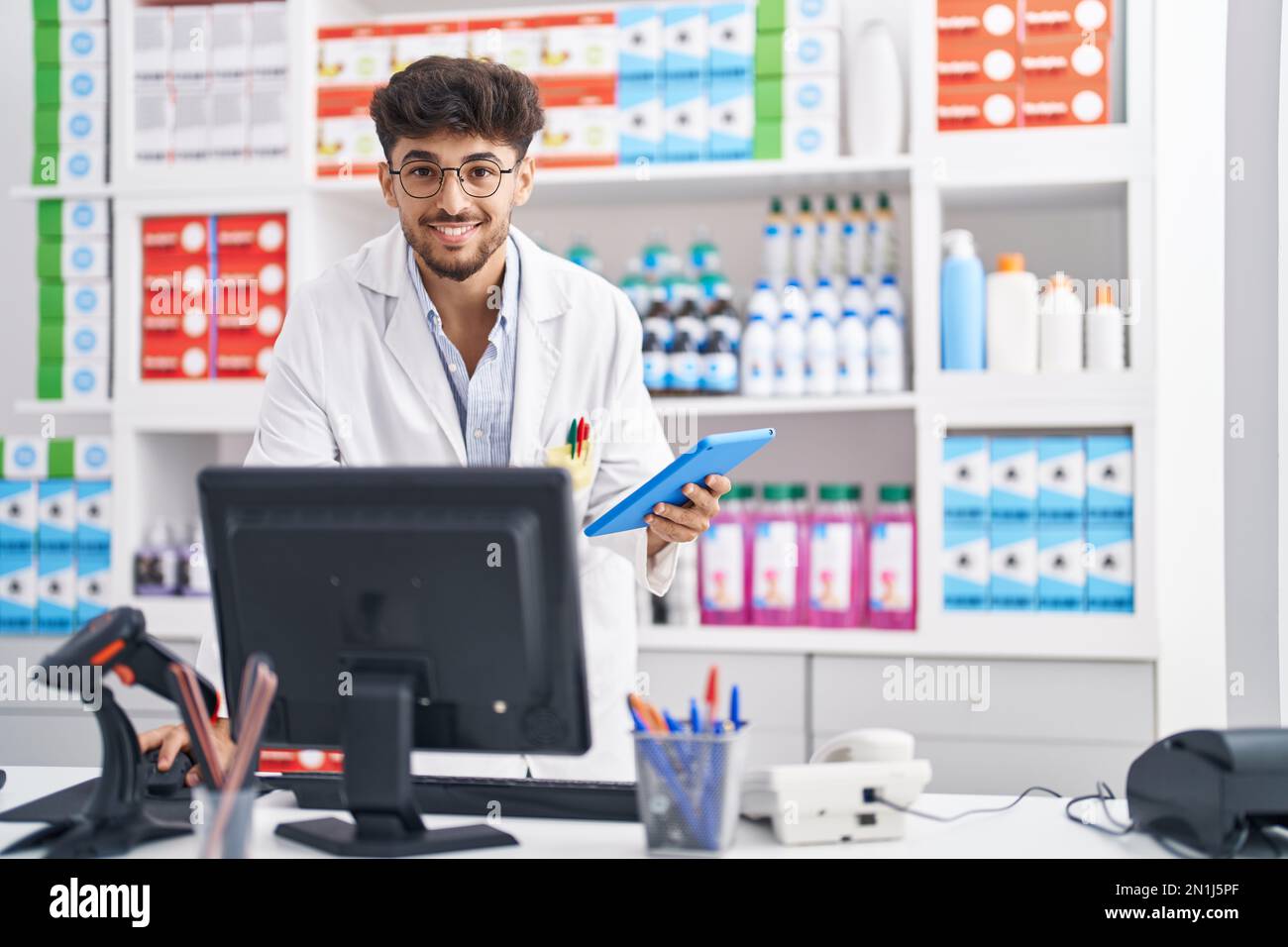Arab pharmacist at counter hi-res stock photography and images - Alamy