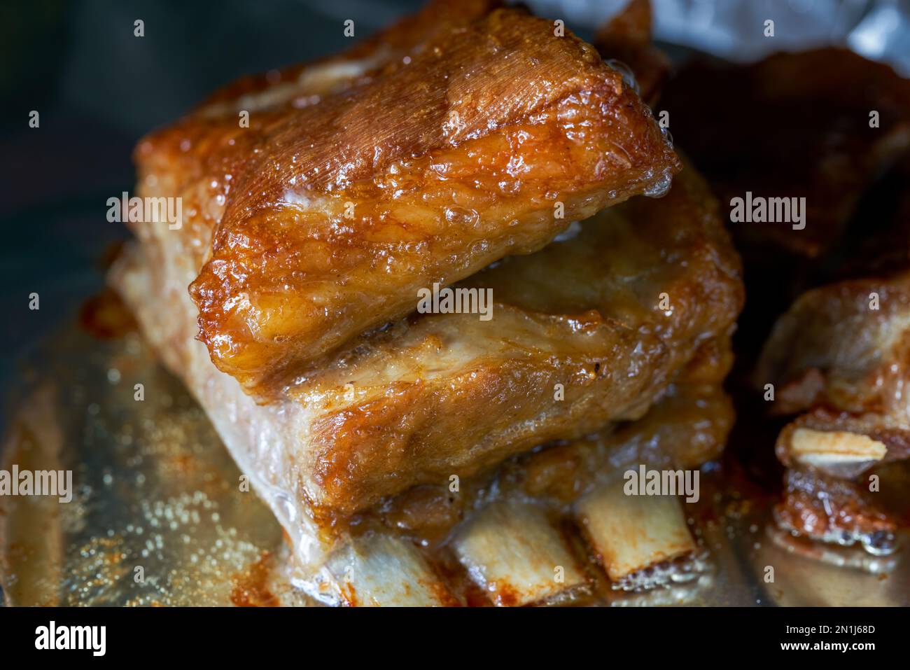 A piece of crispy lamb chops is being baked in the oven Stock Photo - Alamy