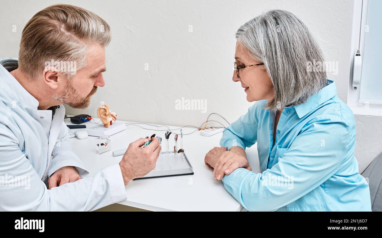 Hearing aids and solutions. Audiologist offers BTE hearing aids to