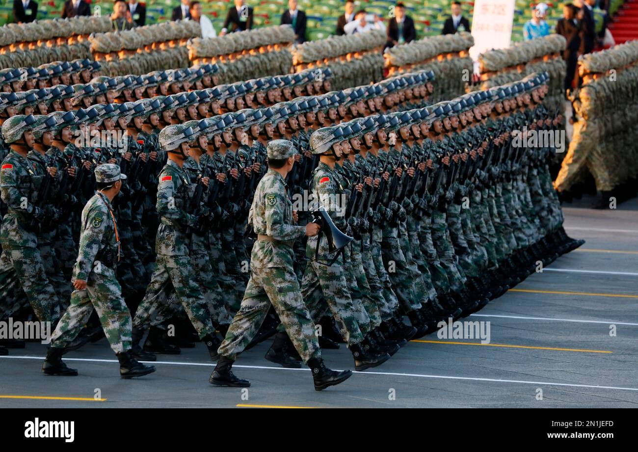Chinese soldiers march into position ahead of a military parade ...