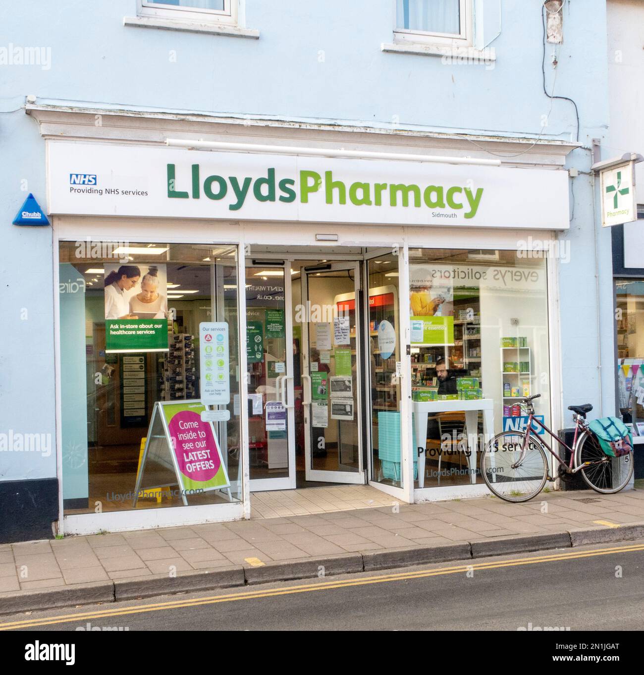 Lloyds Pharmacy, High Street, Sidmouth, Devon. Lloyds chemist. Stock Photo