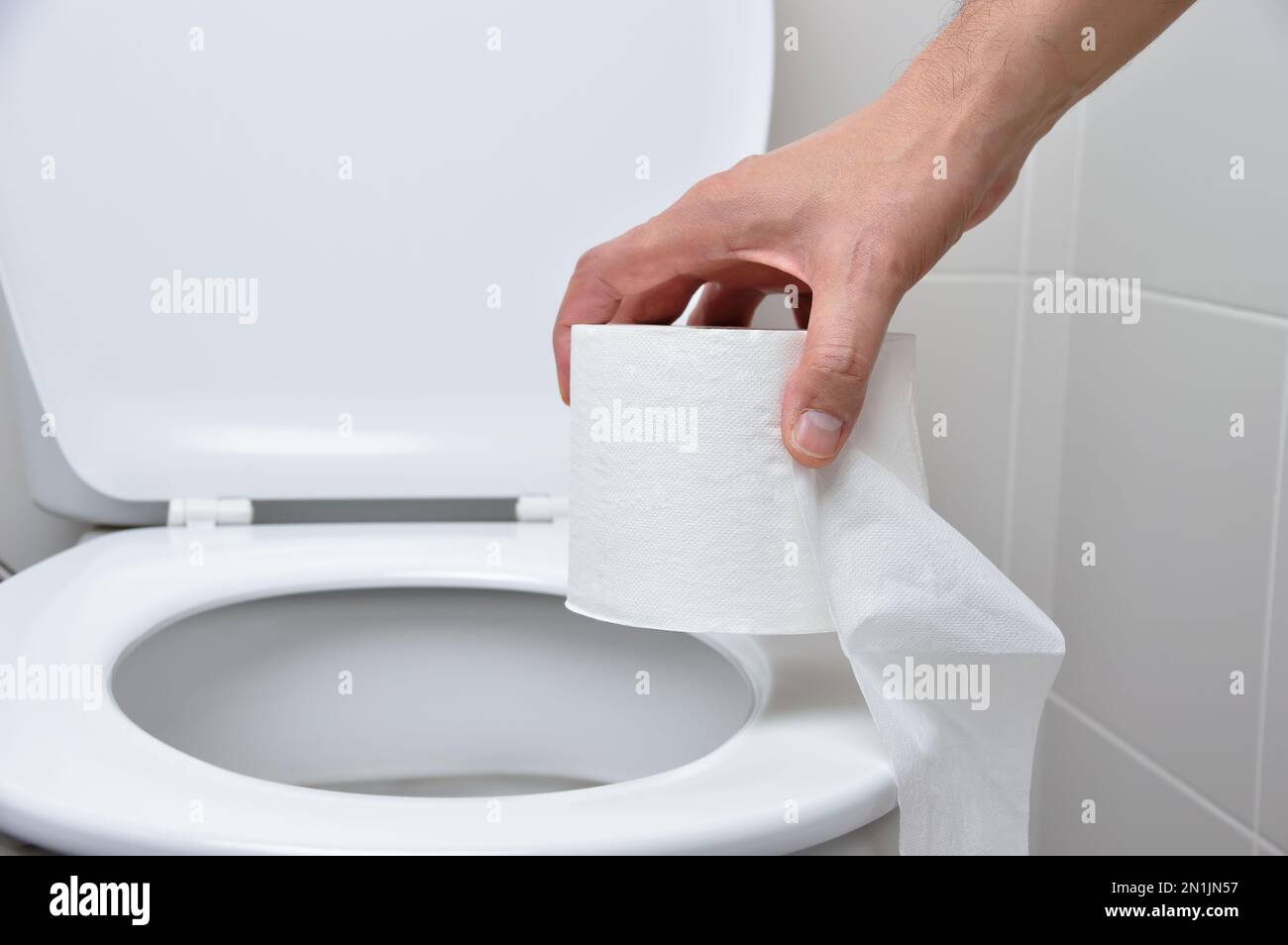 Man using toilet paper hi res stock photography and images Alamy