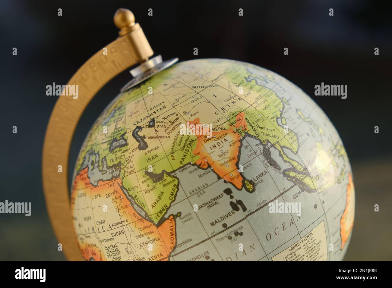 Photo of a gorgeous looking desk globe with focus on Asia - China, India and the Indian Ocean. Shot in natural sun light. Stock Photo