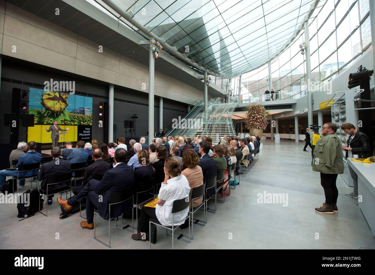 Museum director Axel Ruger, left, gestures as he opens the new entrance ...