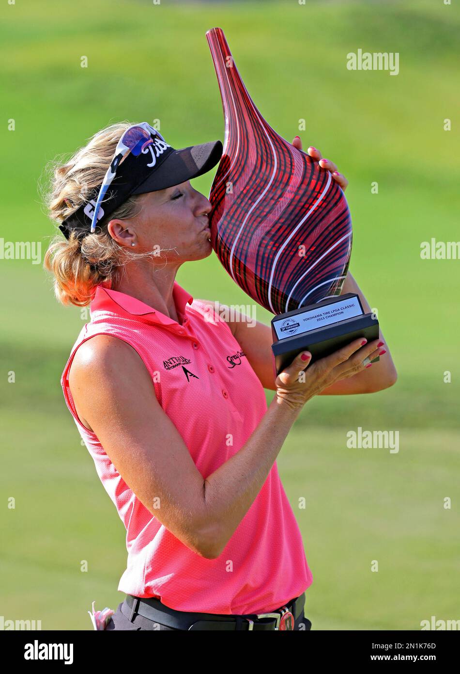 Kris Tamulis kisses the trophy after winning the Yokohama Tire LPGA