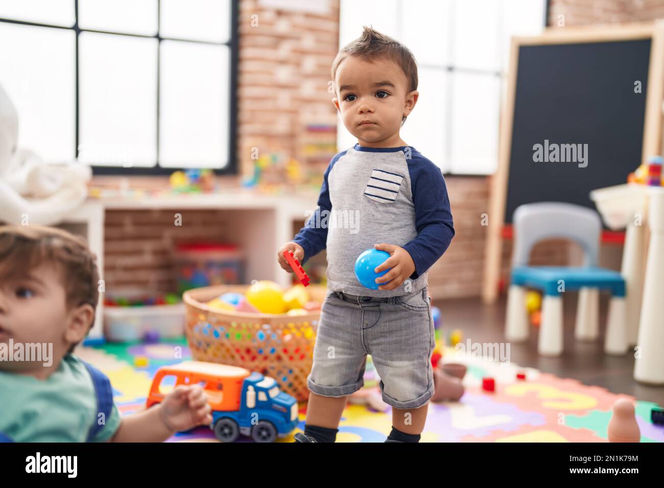 Two kids playing with ball hi-res stock photography and images - Alamy