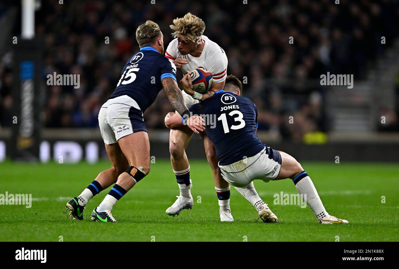 Twickenham. United Kingdom. 04 February 2023. England V Scotland, Culcutta Cup, Guinness 6 Nations. Twickenham Stadium. Twickenham. Ollie Hassell-Collins (England) is tackled by Huw Jones (Scotland, 13) and Stuart Hogg (Scotland) during the England V Scotland, Culcutta Cup rugby match in the Guinness 6 Nations. Stock Photo