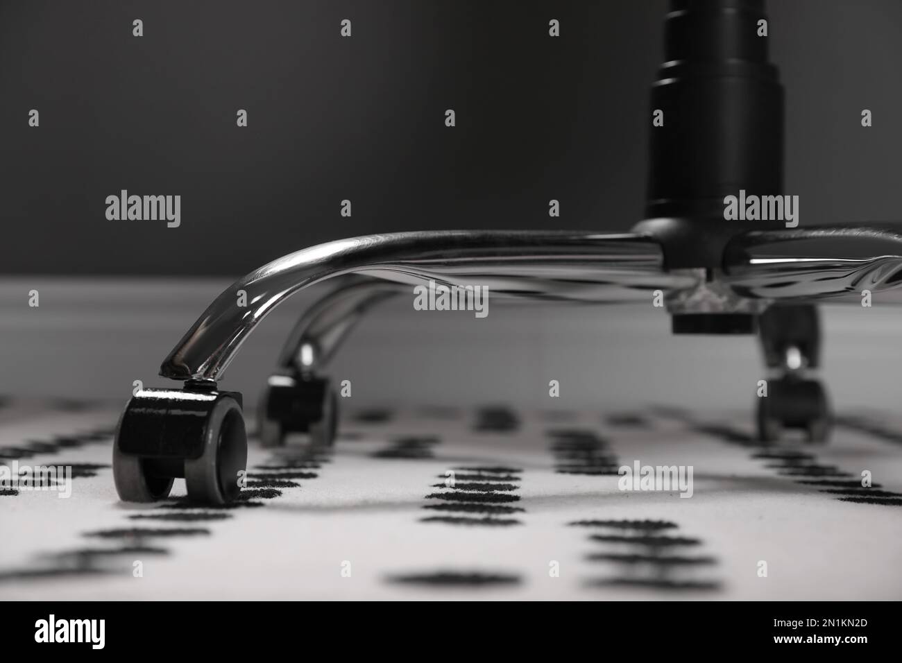 Modern office chair on carpet indoors, closeup. Base with casters Stock