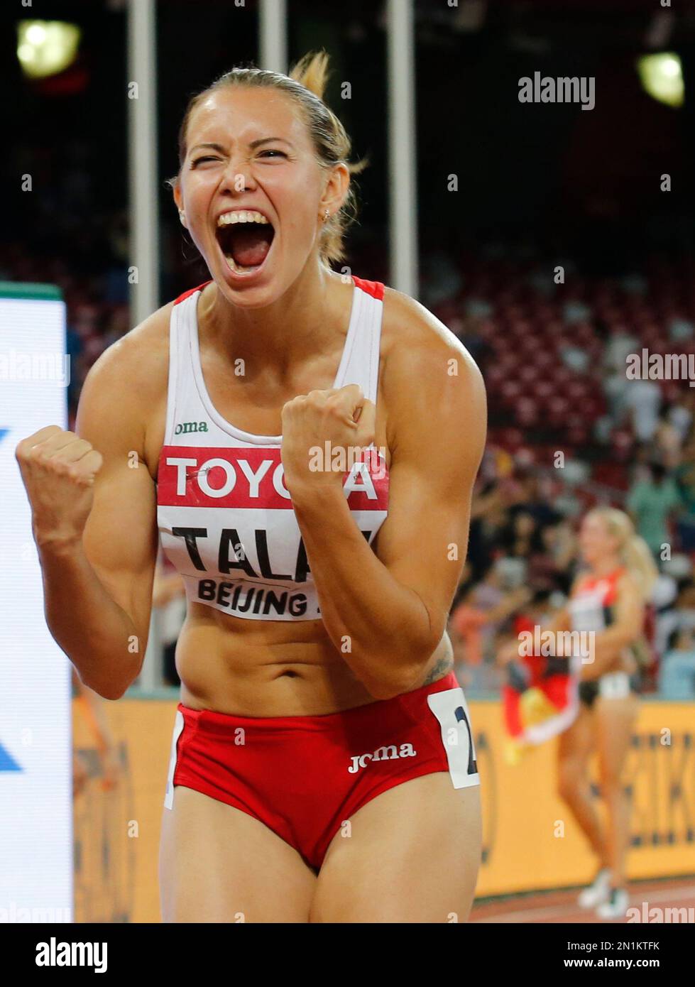 Belarus' Alina Talay celebrates after taking the bronze medal in the