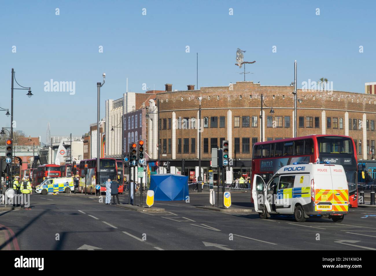 London, UK, 6 February 2022: Brixton centre is closed to traffic after a pedestrian fatality at the junction of Brixton Hill and Coldharbour Lane. An HGV lorry hit the man and did not stop but was later apprehended by police. Many bus routes are disrupted and a quiet, solemn air pervades the normally bustling Brixton Road. Police locally said the road closures were unlikely to be cleared before 6pm. Anna Watson/Alamy Live News Stock Photo