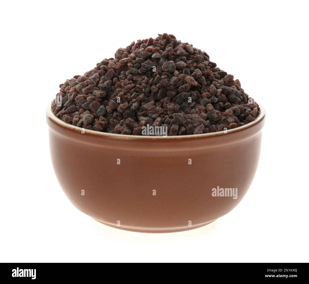 Black salt in ceramic bowl isolated on white Stock Photo