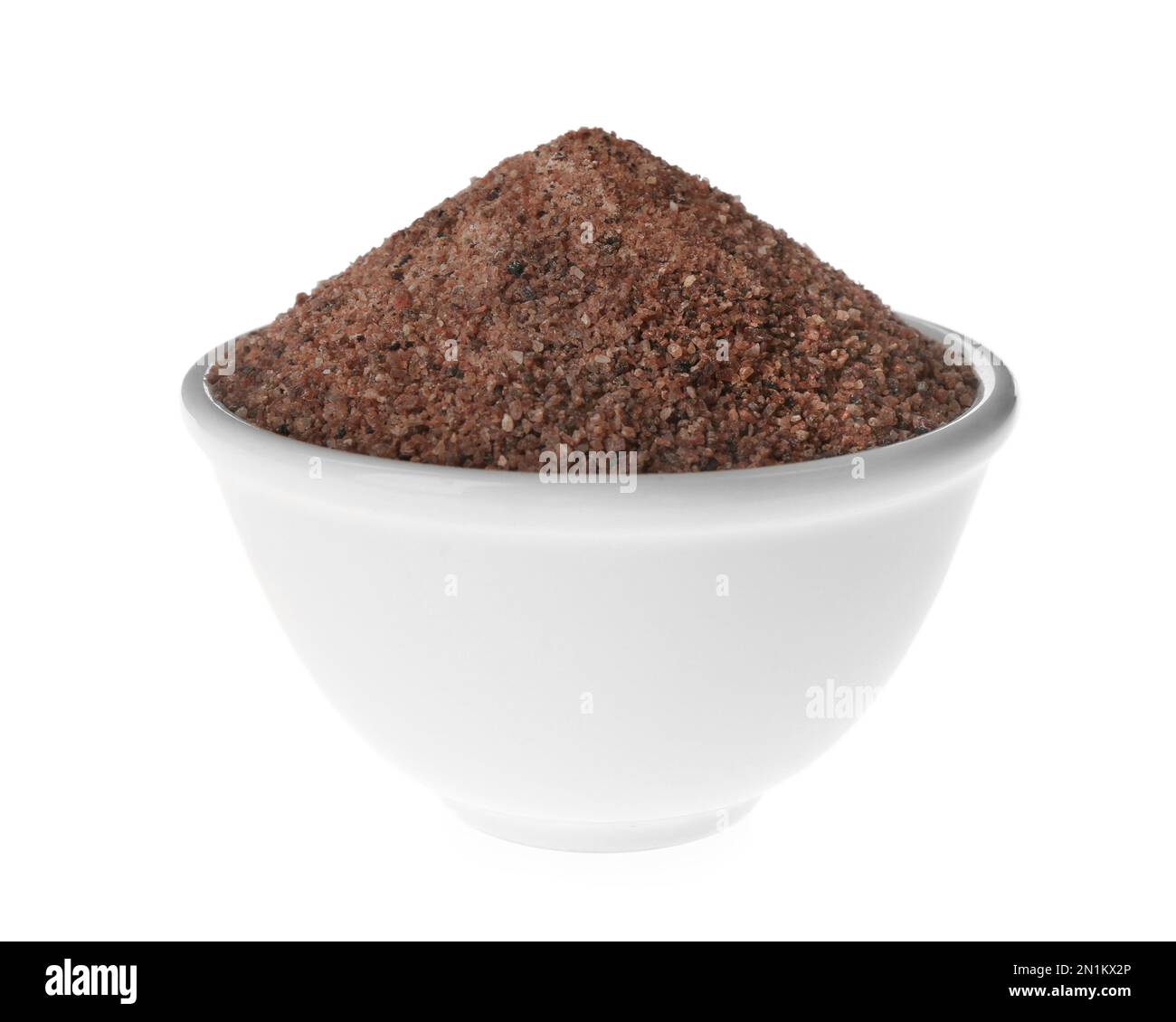 Ground black salt in bowl isolated on white Stock Photo