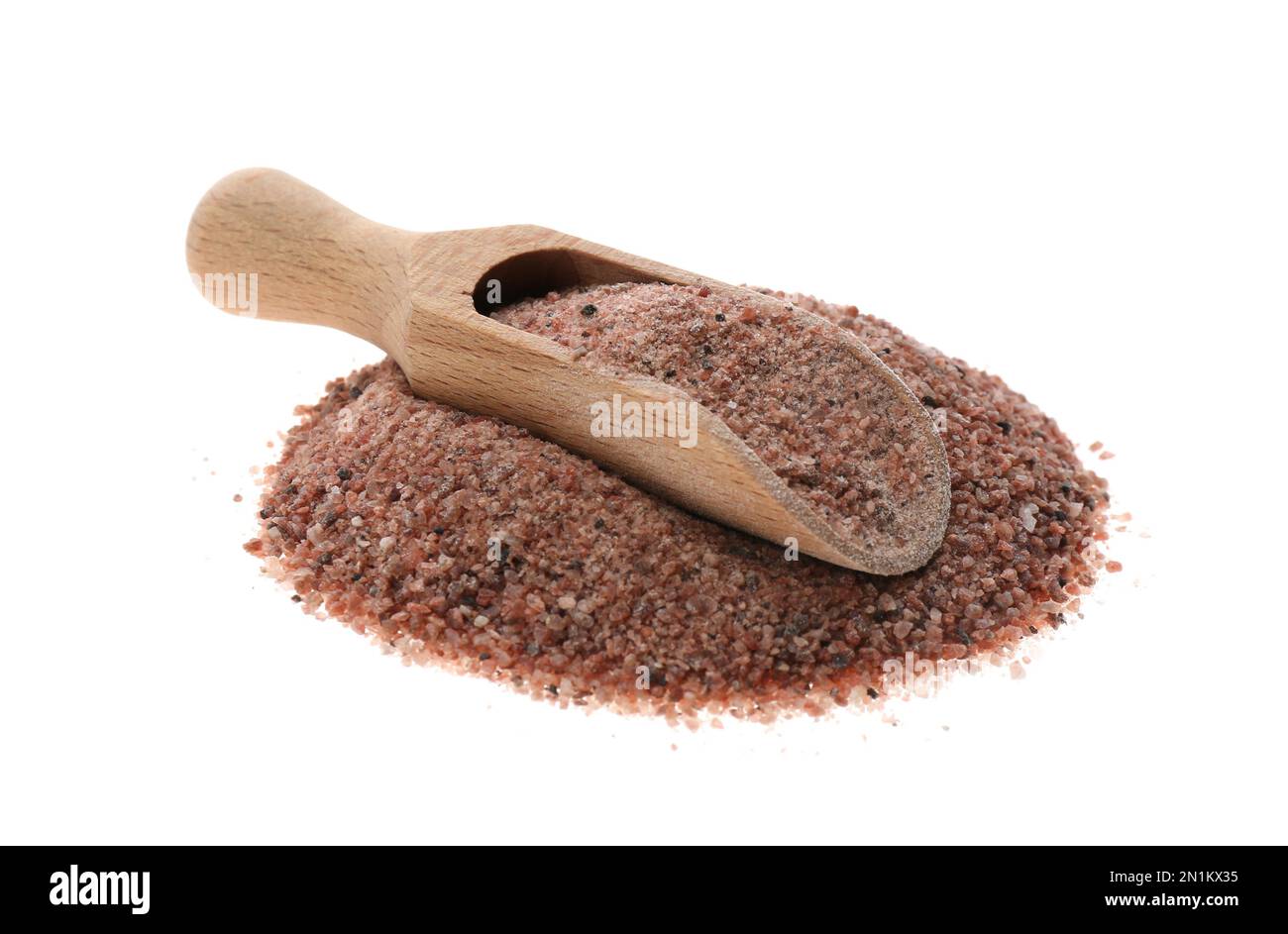 Pile of ground black salt with wooden scoop isolated on white Stock Photo