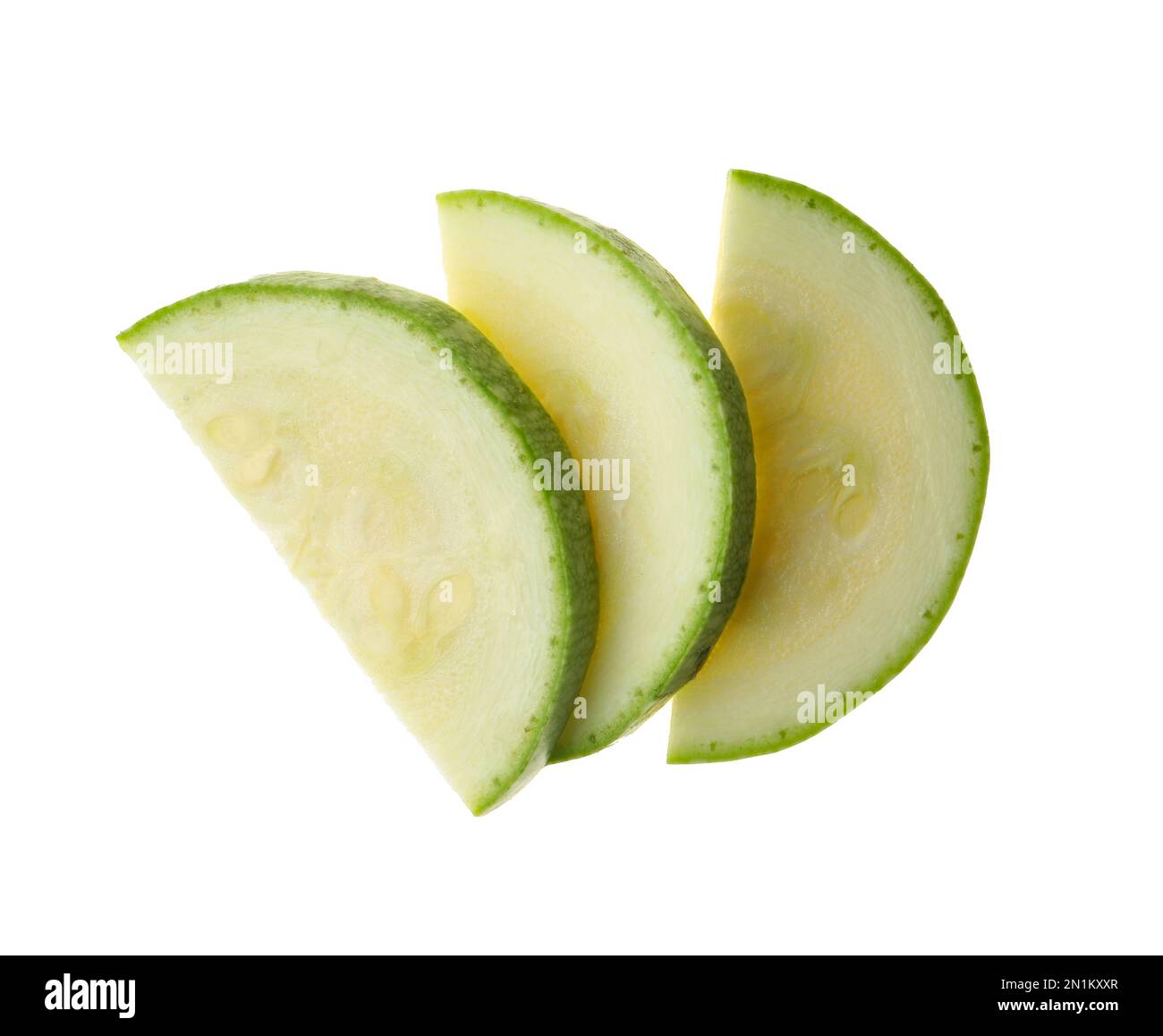 Slices of ripe zucchini on white background, top view Stock Photo