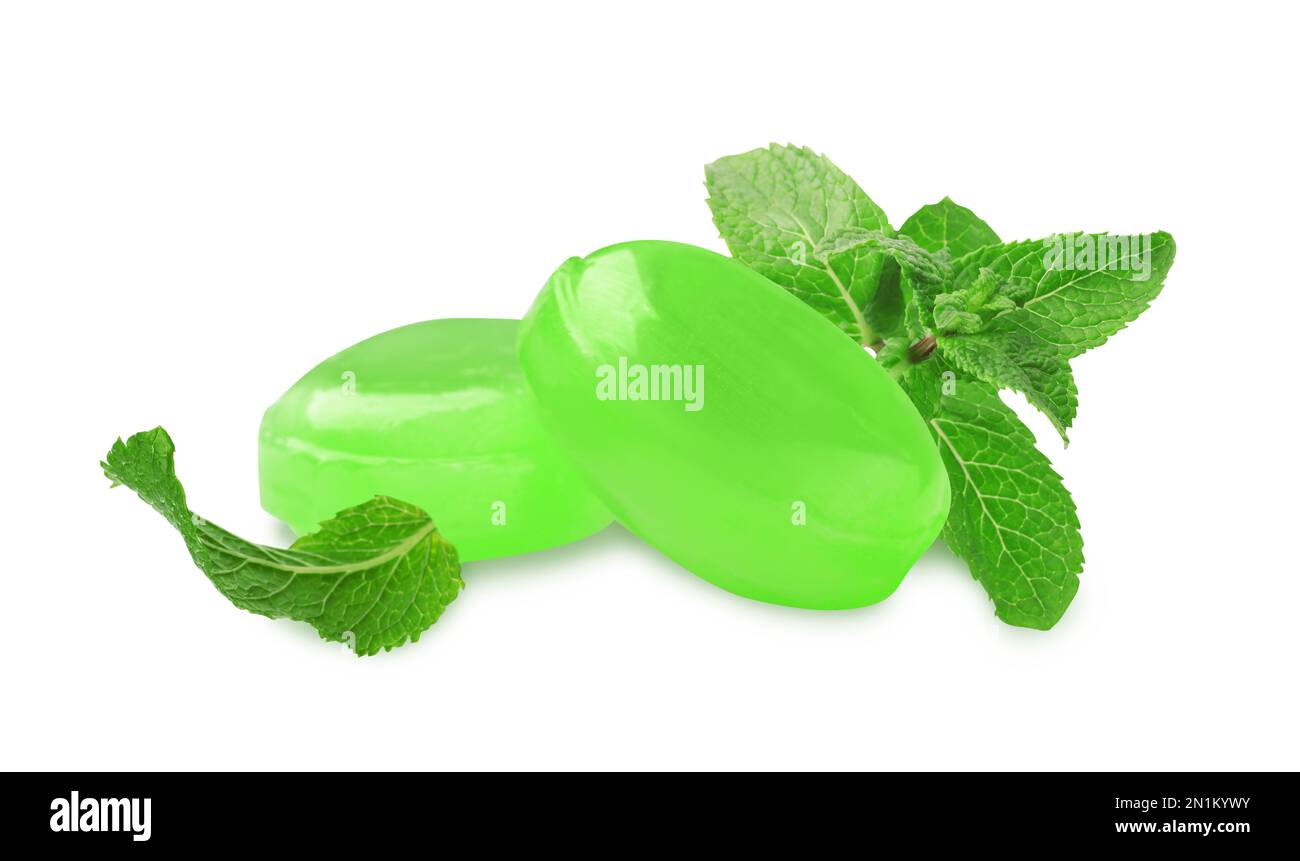Mint hard candies and green leaves on white background Stock Photo Alamy