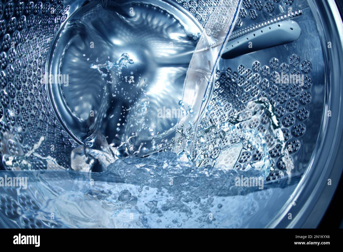 Closeup view on washing machine drum filling with water Stock Photo Alamy