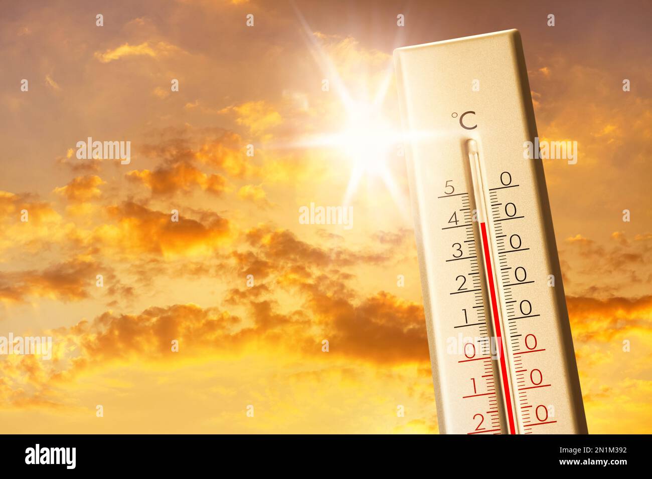 Weather thermometer showing high temperature and sunny sky with clouds