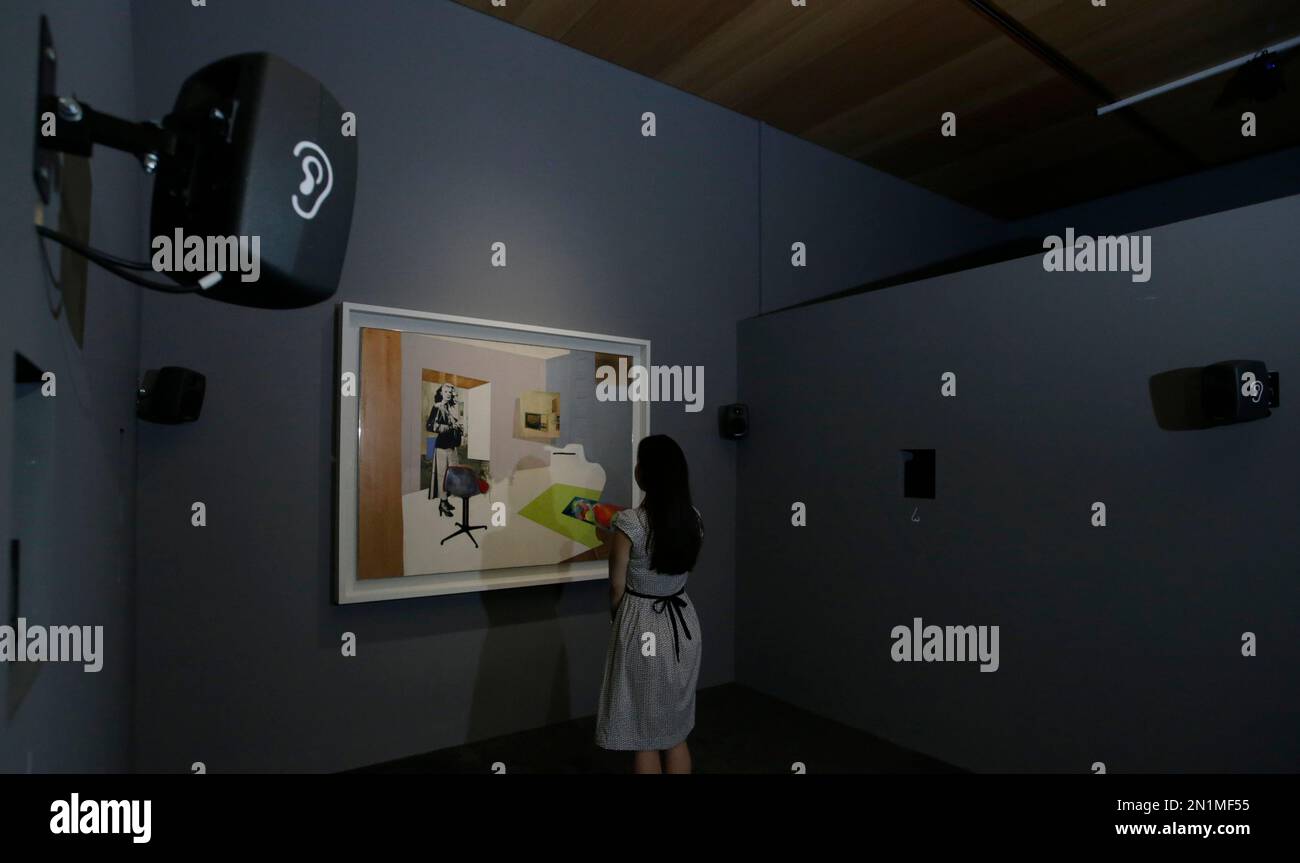Tate Sensorium A member of the Tate Britain staff poses for photographers in front of ...