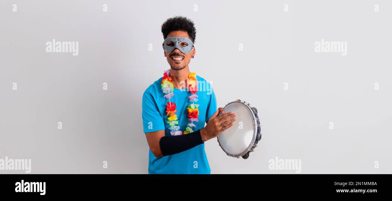 Carnival Brazilian Outfit. Black Man With Carnival Costume Holding a