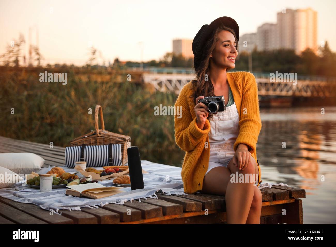 Portrait of smiling young woman at the riverside hi-res stock ...