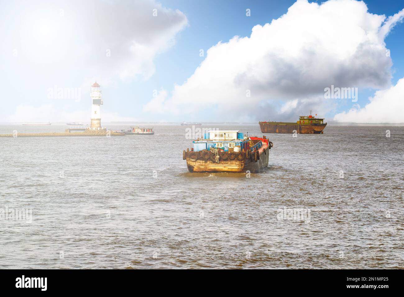 Old China fishing ship headed out to sea from the Huangpu River Stock Photo
