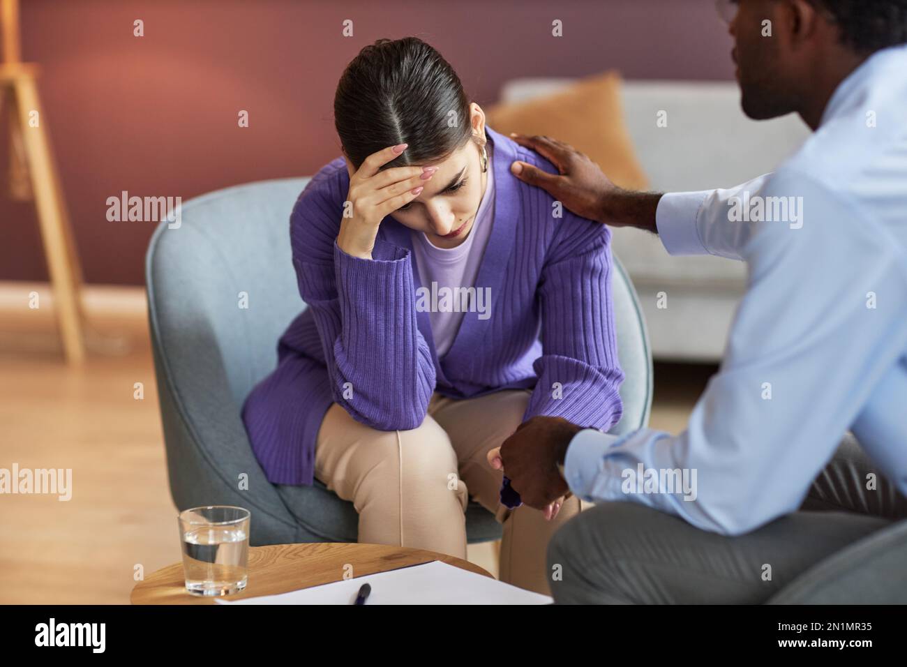therapist-reassuring-depressed-young-woman-stock-photo-alamy