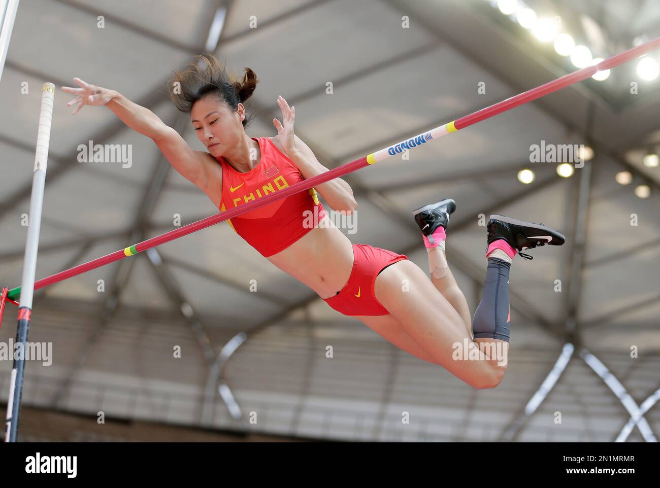 China's Li Ling makes a clearance in women's pole vault qualification ...