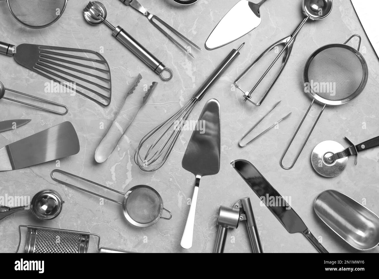 Cooking utensils on grey marble table, flat lay Stock Photo