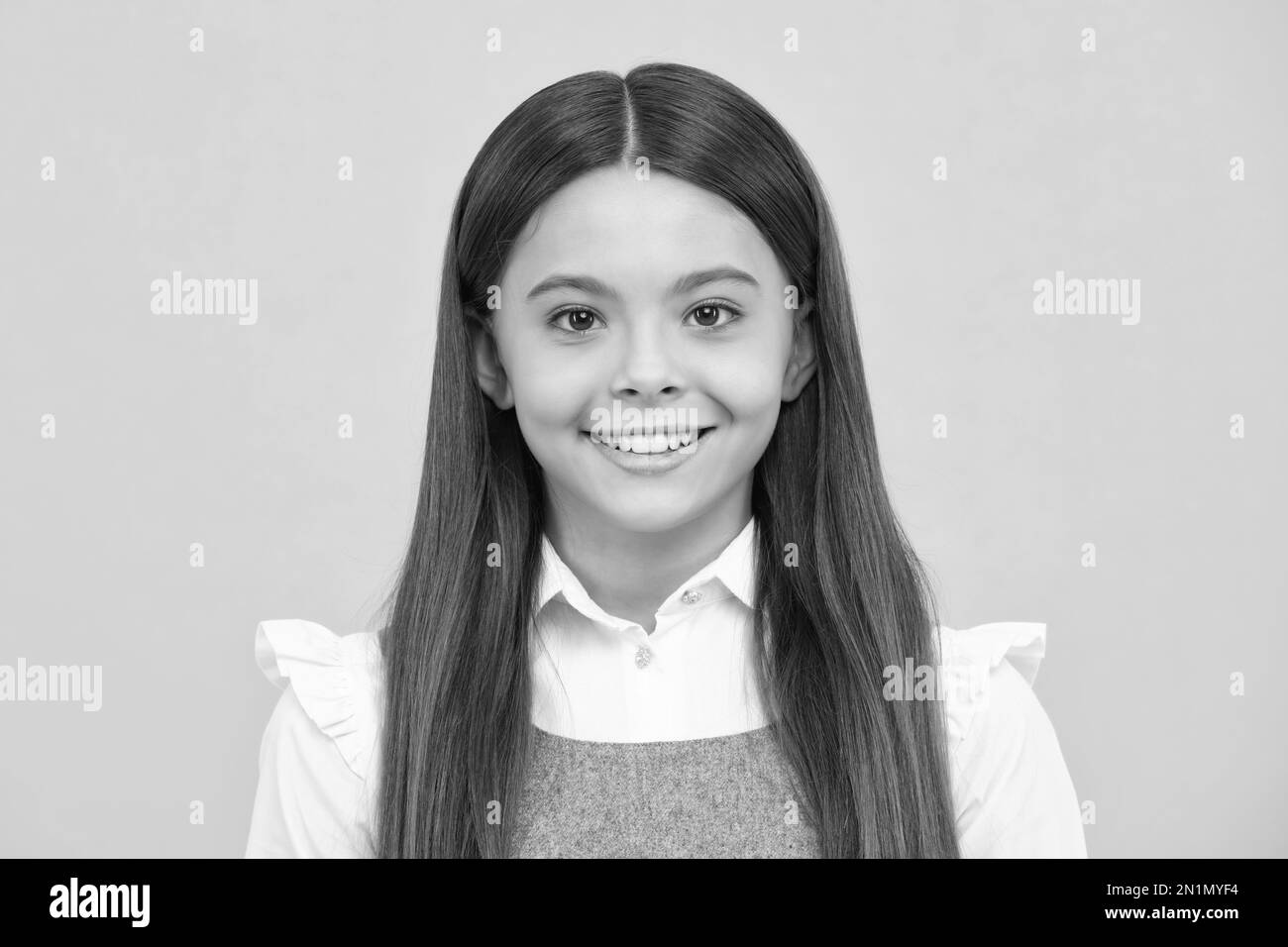 Lifestyle portrait of a child girl smiling at camera, youth day. Happy childrens day. Happy girl