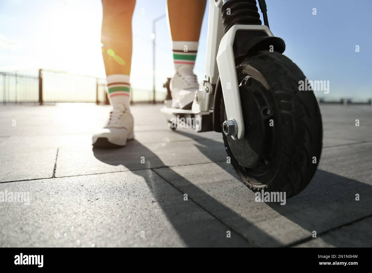 Woman riding on back scooter hi-res stock photography and images - Alamy