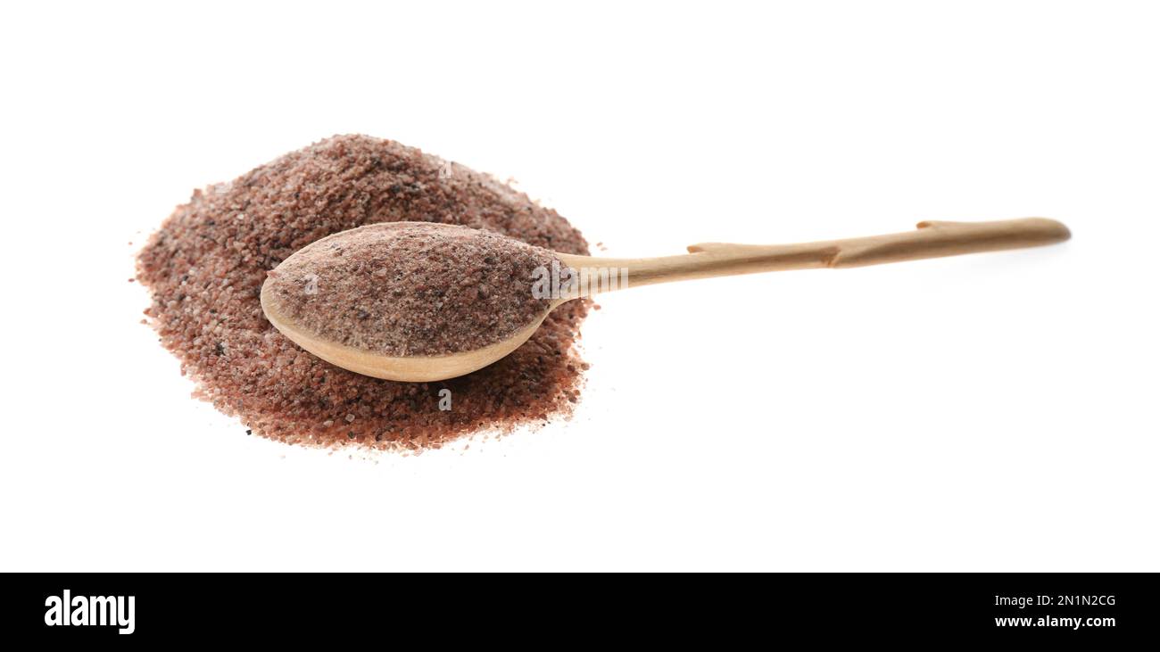 Pile of ground black salt with wooden spoon isolated on white Stock Photo