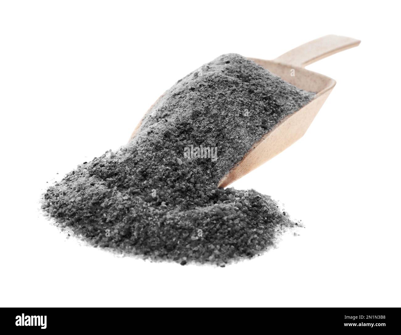 Pile of ground black salt and scoop on white background Stock Photo