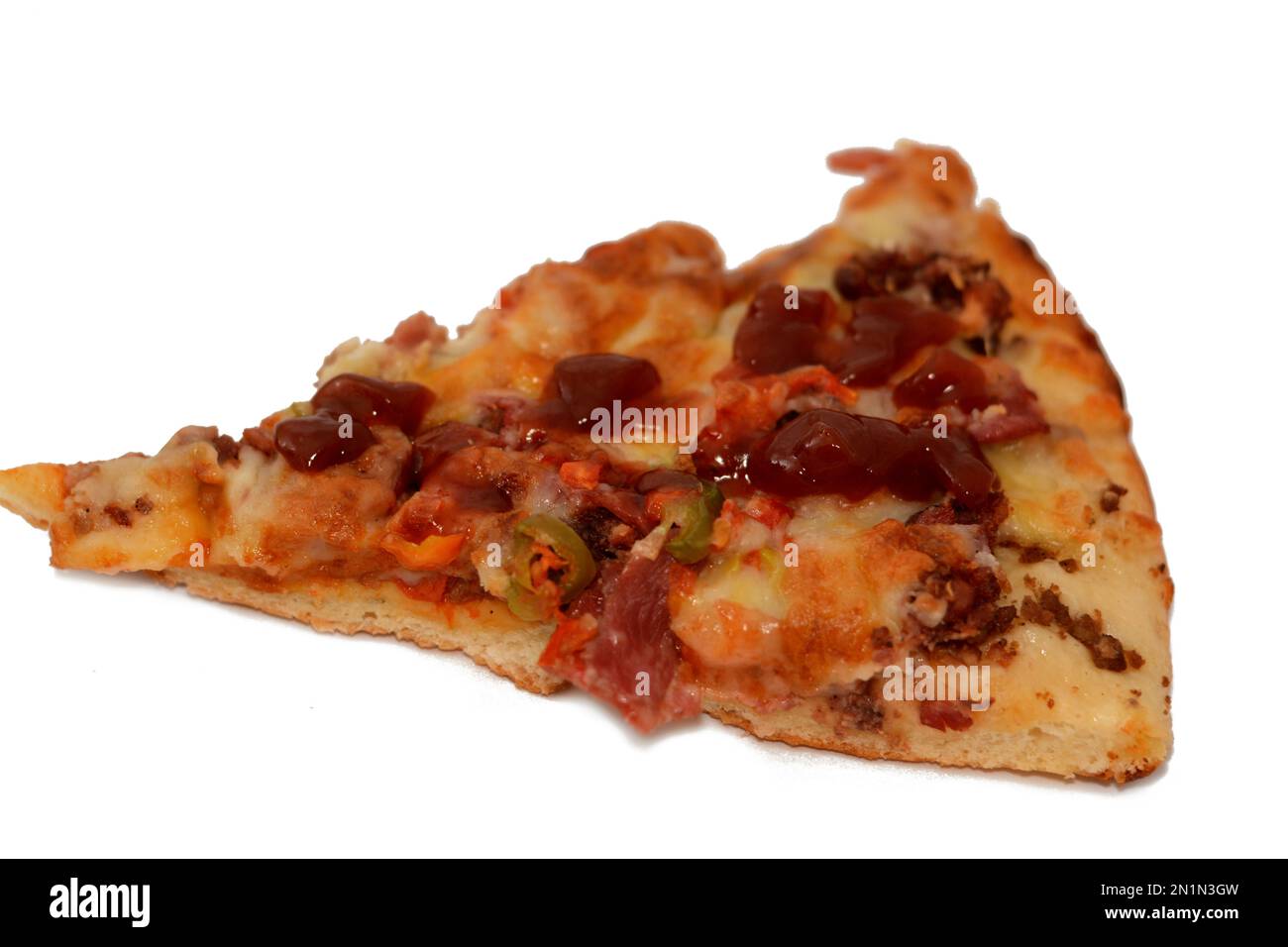 Italian pizza with pieces of pastrami, meat, beef and salami, with