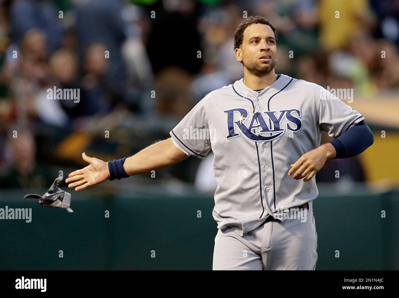 Tampa Bay Rays' James Loney tosses his glove after being ejected in the sixth inning of a