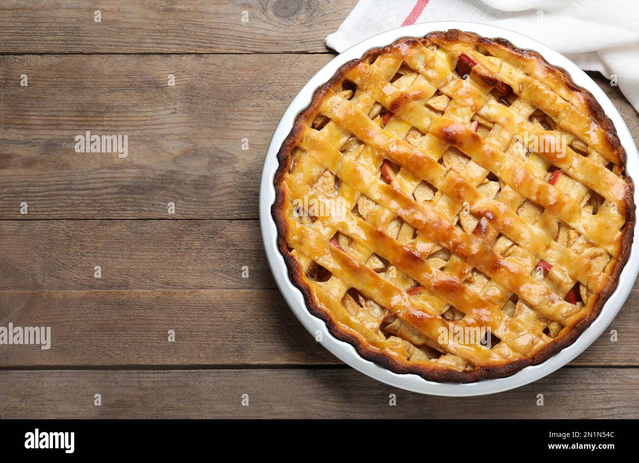 Traditional apple pie on wooden table, top view. Space for text Stock Photo