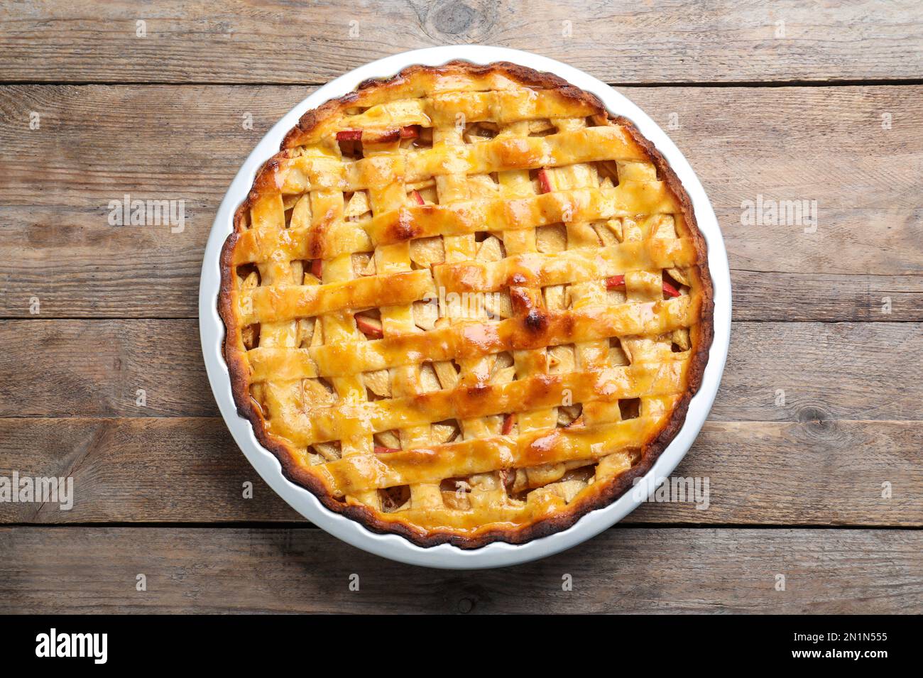 Traditional apple pie on wooden table, top view Stock Photo