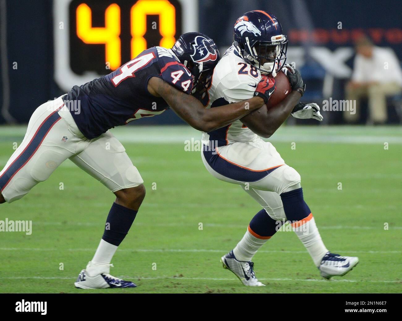 Denver Broncos' Montee Ball (28) is hit by Houston Texans' Carlos Thompson  (44) during the first half of an NFL preseason football game, Saturday,  Aug. 22, 2015, in Houston. (AP Photo/George Bridges, image size:1300x1039