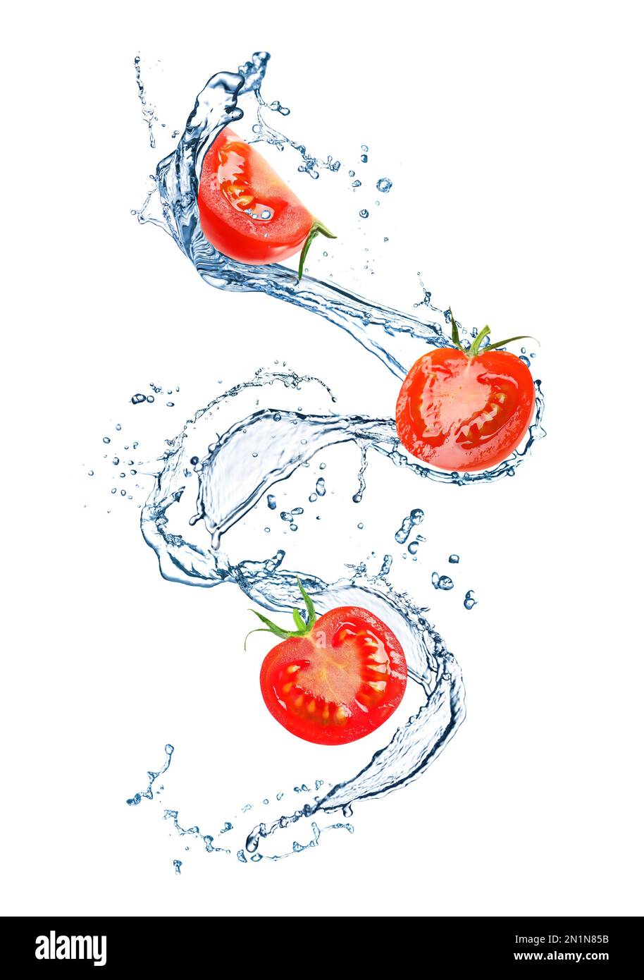 Fresh cut tomatoes with water splash on white background Stock Photo ...