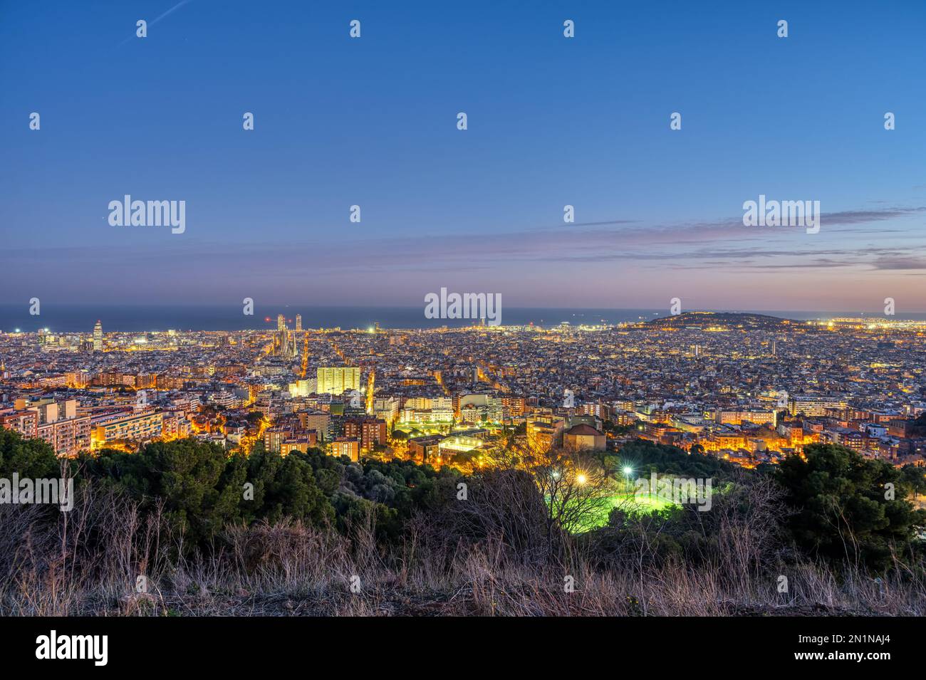 The skyline of Barcelona in Spain at dusk Stock Photo